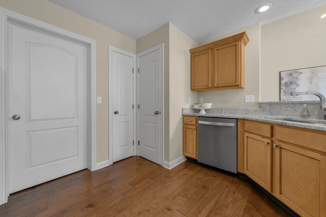 6277 Hudson Reserve Way, Westerville, OH 43081 - kitchen featuring stainless steel dishwasher, dark wood-style flooring, light stone countertops, and recessed lighting
