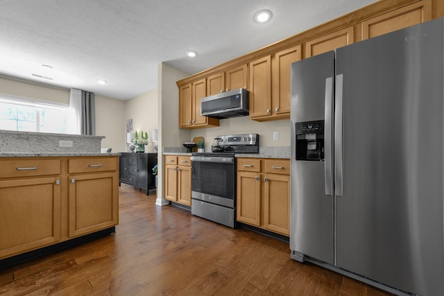 6277 Hudson Reserve Way, Westerville, OH 43081 - kitchen featuring appliances with stainless steel finishes, dark wood-type flooring, recessed lighting, light stone counters, and brown cabinets