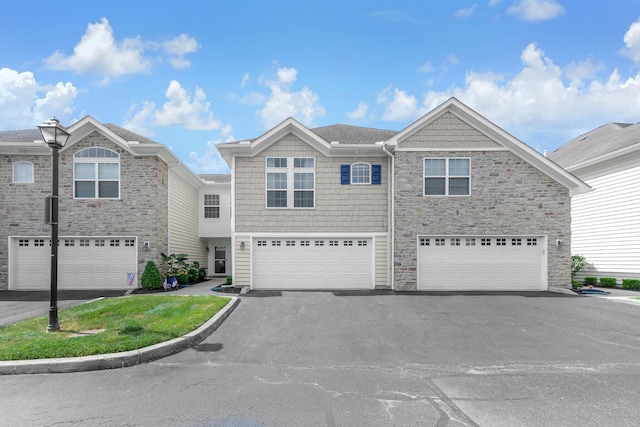 6277 Hudson Reserve Way, Westerville, OH 43081 - view of property featuring stone siding, driveway, and a garage