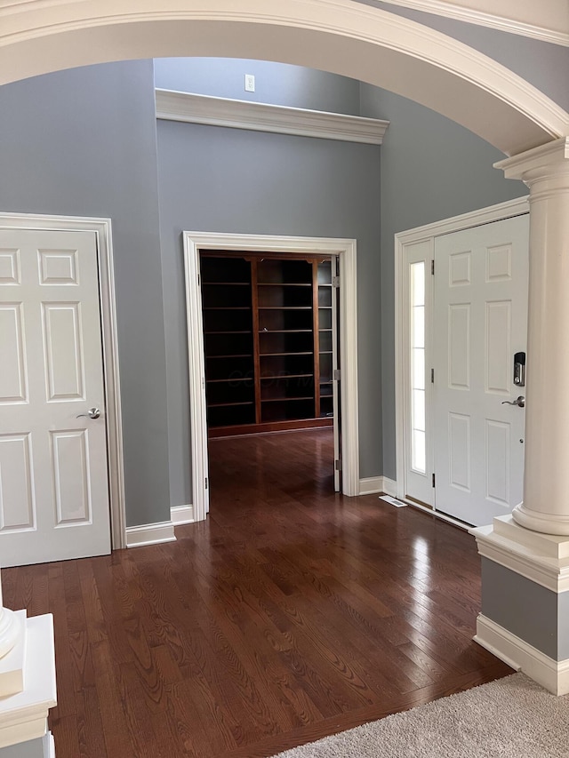 8730 Swisher Creek Xing, New Albany, OH 43054 - entryway featuring decorative columns, arched walkways, and dark wood-type flooring