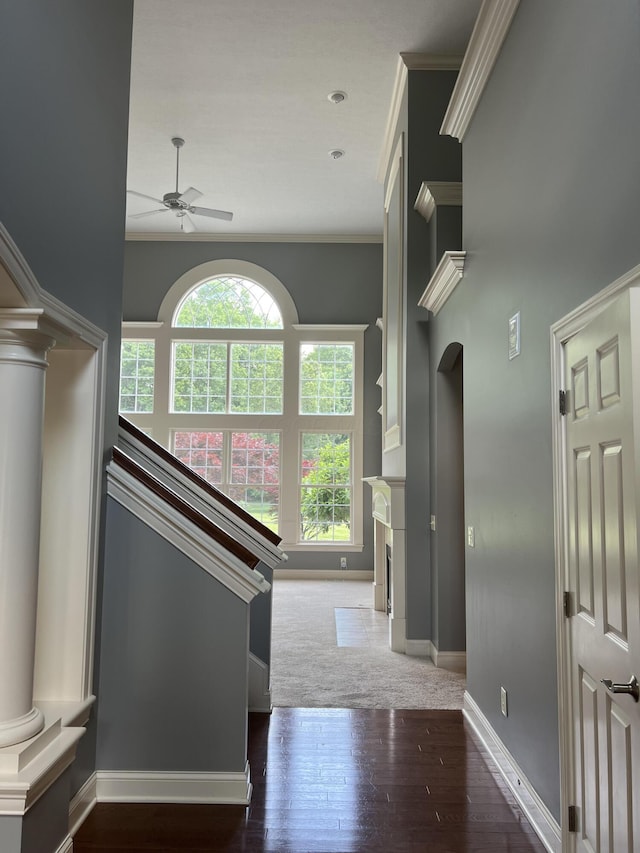 8730 Swisher Creek Xing, New Albany, OH 43054 - hallway with ornamental molding, wood finished floors, decorative columns, arched walkways, and a high ceiling