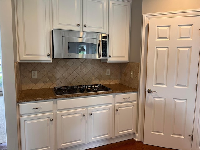 8730 Swisher Creek Xing, New Albany, OH 43054 - kitchen with stainless steel microwave, gas stovetop, and white cabinets