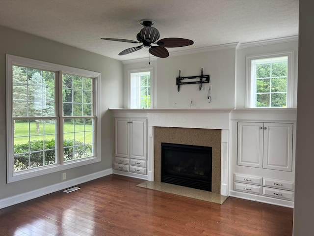 8730 Swisher Creek Xing, New Albany, OH 43054 - unfurnished living room with a ceiling fan, dark wood-type flooring, a fireplace with flush hearth, a textured ceiling, and crown molding