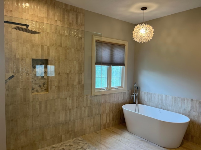 8730 Swisher Creek Xing, New Albany, OH 43054 - full bath featuring tile walls, a freestanding bath, a tile shower, and wainscoting