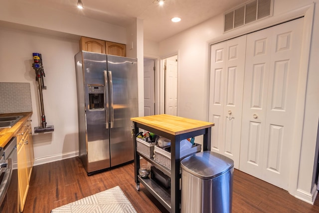 283 Lear St Unit 7, Columbus, OH 43206 - kitchen with stainless steel fridge, wood counters, dark wood-type flooring, and recessed lighting