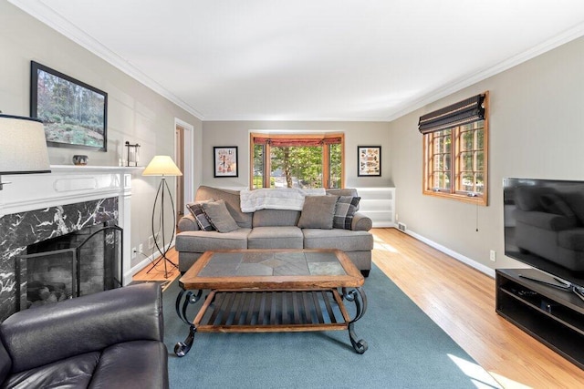 1855 Suffolk Rd, Columbus, OH 43221 - living room featuring crown molding, wood finished floors, and a high end fireplace