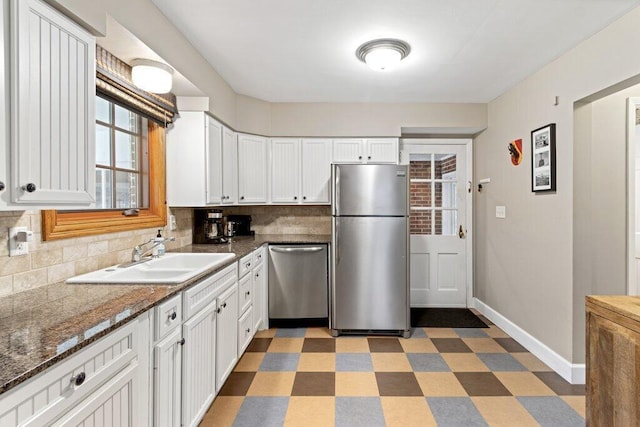 1855 Suffolk Rd, Columbus, OH 43221 - kitchen featuring stainless steel appliances, backsplash, light flooring, and white cabinetry
