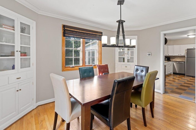 1855 Suffolk Rd, Columbus, OH 43221 - dining area with a chandelier, ornamental molding, and light wood-type flooring
