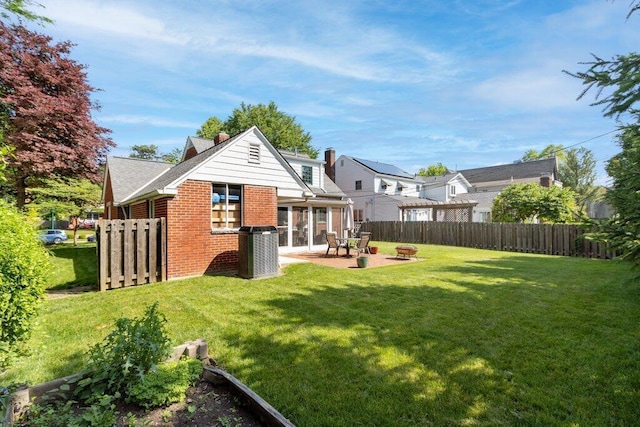 1855 Suffolk Rd, Columbus, OH 43221 - rear view of property with brick siding, a patio, and a fire pit