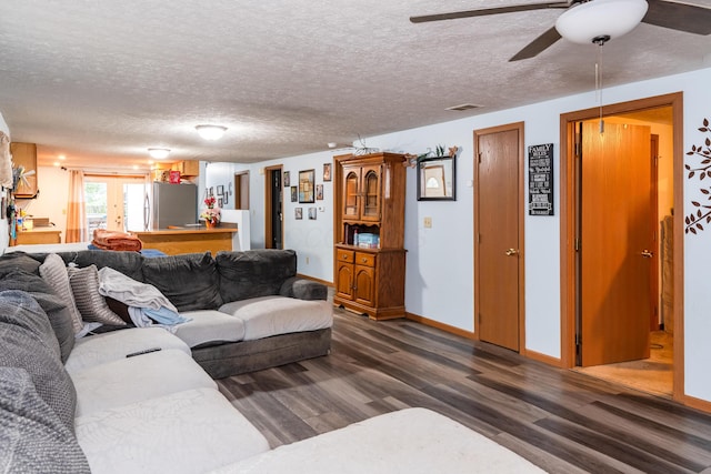 508 Carolyn Rd, Washington Court House, OH 43160 - living room with wood finished floors, a ceiling fan, and a textured ceiling