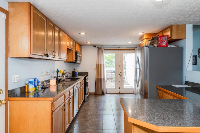 508 Carolyn Rd, Washington Court House, OH 43160 - kitchen with stainless steel appliances, dark countertops, recessed lighting, a textured ceiling, and dark tile patterned floors