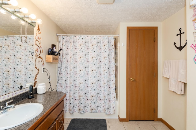 508 Carolyn Rd, Washington Court House, OH 43160 - bathroom featuring vanity, tile patterned flooring, shower / bath combo with shower curtain, a textured ceiling, and a wall unit AC