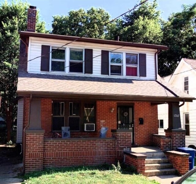 1747 E Mound St, Columbus, OH 43205 - view of front of home with a chimney, covered porch, brick siding, and a shingled roof
