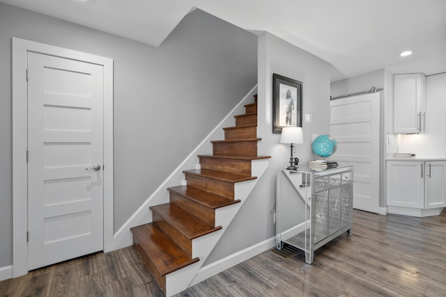 50 S Kellner Rd, Columbus, OH 43209 - stairs with wood finished floors, a barn door, and recessed lighting