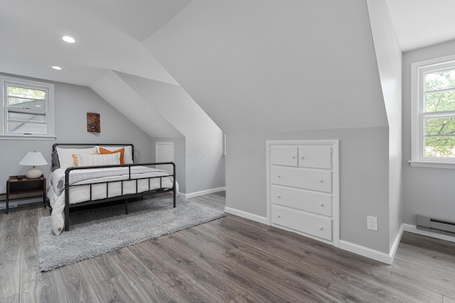 50 S Kellner Rd, Columbus, OH 43209 - bedroom with wood finished floors, a baseboard radiator, lofted ceiling, and recessed lighting