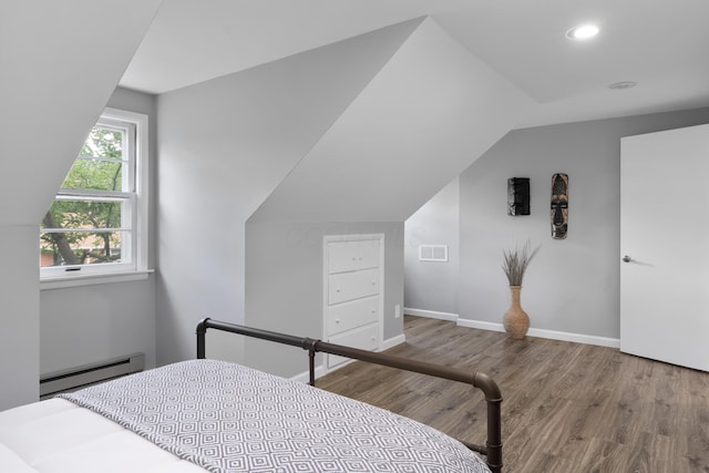 50 S Kellner Rd, Columbus, OH 43209 - bedroom featuring a baseboard heating unit, wood finished floors, lofted ceiling, and recessed lighting