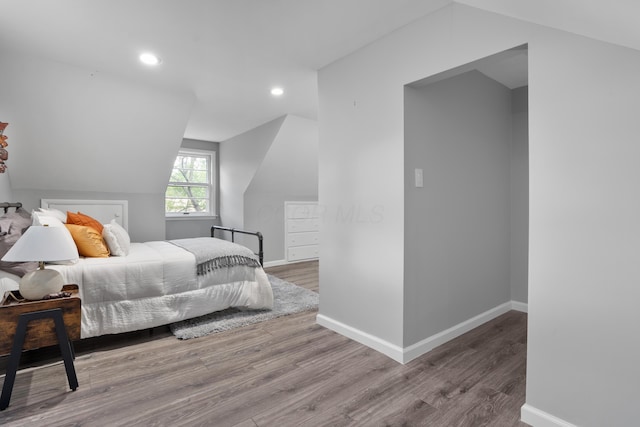 50 S Kellner Rd, Columbus, OH 43209 - bedroom with wood finished floors, vaulted ceiling, and recessed lighting