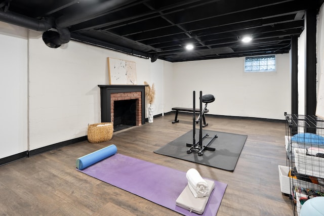 50 S Kellner Rd, Columbus, OH 43209 - exercise room with wood finished floors and a brick fireplace