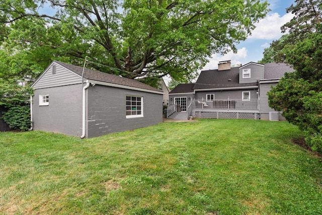 50 S Kellner Rd, Columbus, OH 43209 - rear view of property with an outbuilding, a chimney, a yard, and a wooden deck