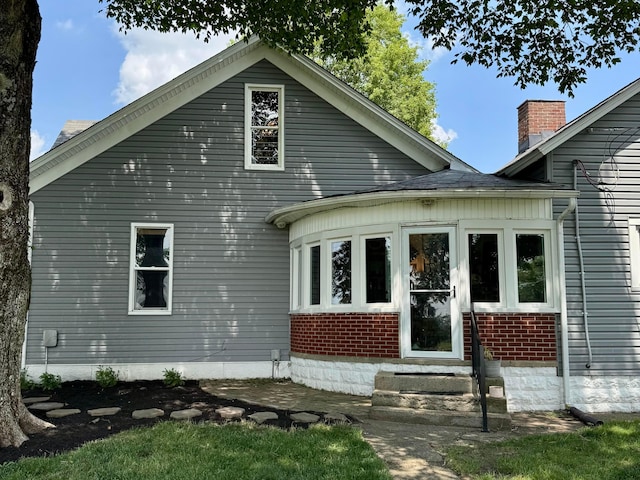 4640 Chillicothe Lancaster Rd SW, Lancaster, OH 43130 - back of property featuring entry steps, brick siding, and a chimney