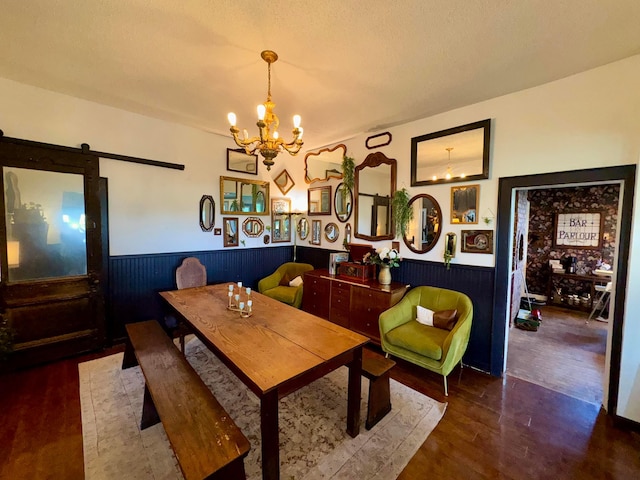 4640 Chillicothe Lancaster Rd SW, Lancaster, OH 43130 - dining space featuring a chandelier, wainscoting, wood finished floors, and a barn door