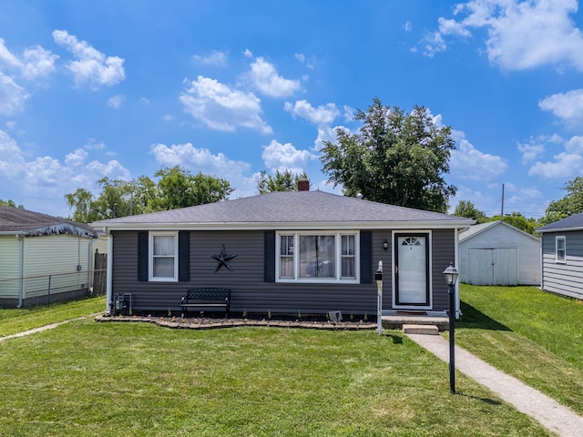 1221 S Main St, Washington Court House, OH 43160 - view of front of house with a storage shed, a chimney, and roof with shingles