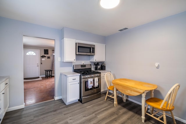 1221 S Main St, Washington Court House, OH 43160 - kitchen with stainless steel appliances, wood finished floors, and light countertops