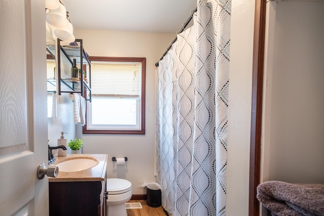 1221 S Main St, Washington Court House, OH 43160 - bathroom featuring vanity, a shower with shower curtain, and wood finished floors