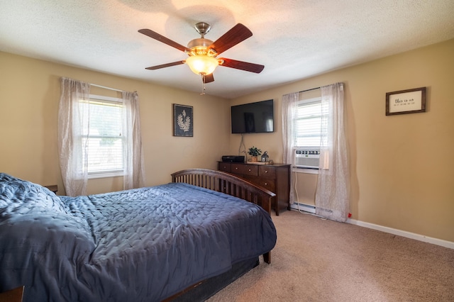 1221 S Main St, Washington Court House, OH 43160 - bedroom with light colored carpet, cooling unit, ceiling fan, and baseboard heating