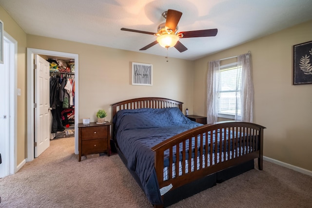 1221 S Main St, Washington Court House, OH 43160 - carpeted bedroom with a walk in closet, ceiling fan, and a closet