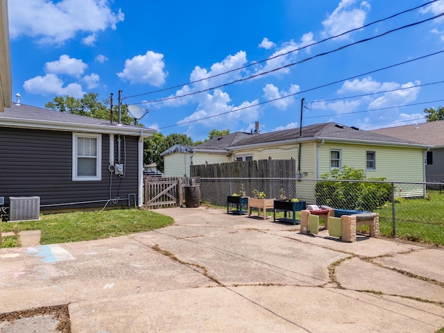 1221 S Main St, Washington Court House, OH 43160 - rear view of house with a patio and a gate