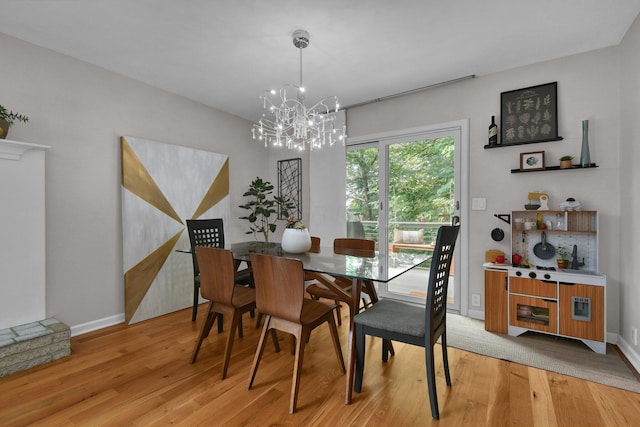 160 Wildwood Dr, Granville, OH 43023 - dining space featuring a chandelier and light wood-style floors