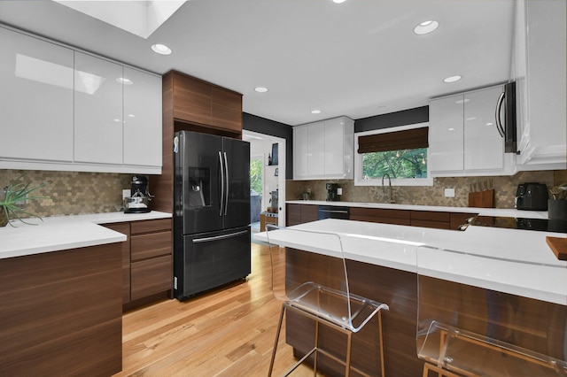 160 Wildwood Dr, Granville, OH 43023 - kitchen with refrigerator with ice dispenser, modern cabinets, white cabinetry, light countertops, and recessed lighting