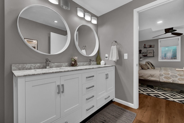 160 Wildwood Dr, Granville, OH 43023 - ensuite bathroom with wood finished floors, double vanity, ceiling fan, and recessed lighting