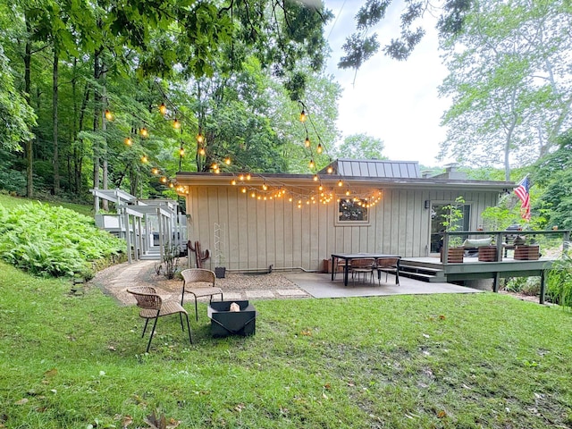 160 Wildwood Dr, Granville, OH 43023 - rear view of house featuring a deck and a lawn