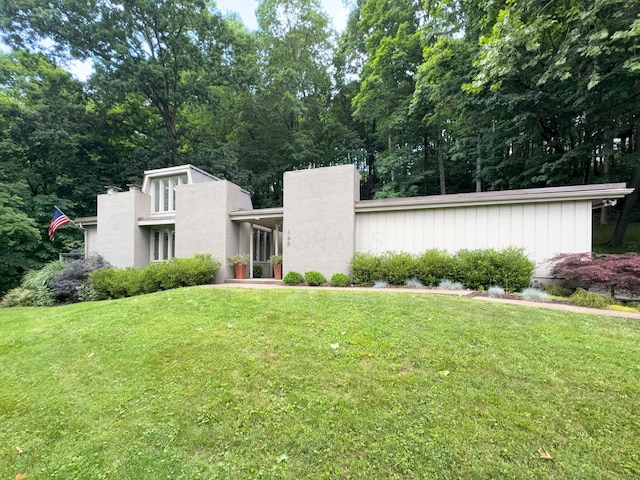 160 Wildwood Dr, Granville, OH 43023 - view of front of property with a front lawn and a chimney