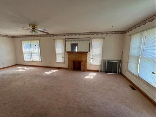 498 E Mark St, Marion, OH 43302 - unfurnished living room featuring carpet flooring, a fireplace, and ceiling fan