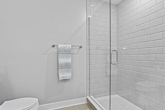 105 N Riverview St Unit 218, Dublin, OH 43017 - bathroom with baseboards and a shower stall