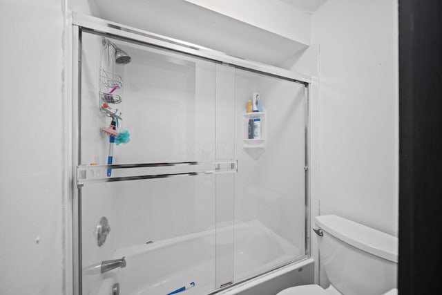 1208 Ashland Ave, Columbus, OH 43212 - bathroom with combined bath / shower with glass door and toilet