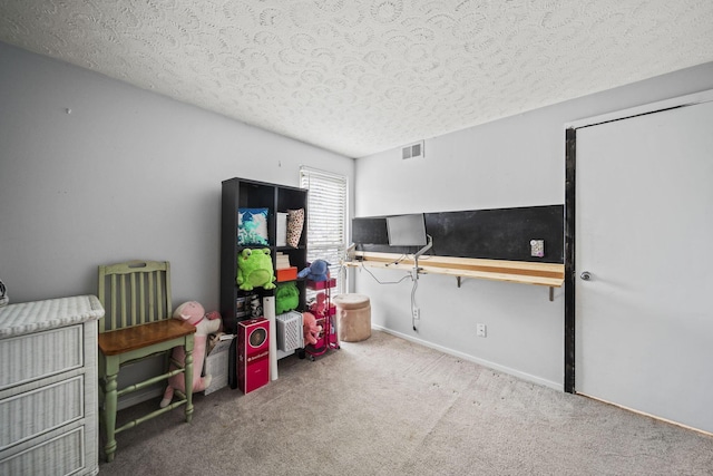 1208 Ashland Ave, Columbus, OH 43212 - game room with a textured ceiling and carpet