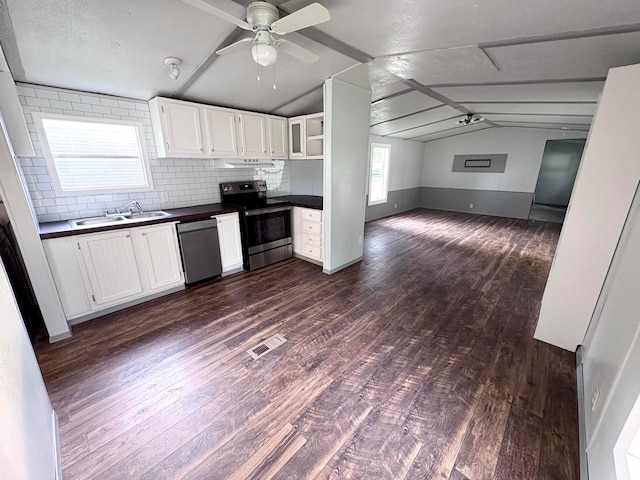18 Skyline Dr, South Bloomfield, OH 43103 - kitchen with stainless steel appliances, dark countertops, a ceiling fan, lofted ceiling, and dark wood-style floors