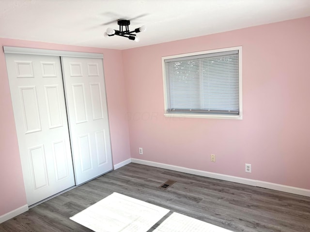 18 Skyline Dr, South Bloomfield, OH 43103 - unfurnished bedroom with wood finished floors and a closet