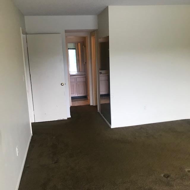 1395 Lake Shore Dr Unit 122, Columbus, OH 43204 - spare room with dark carpet and baseboards