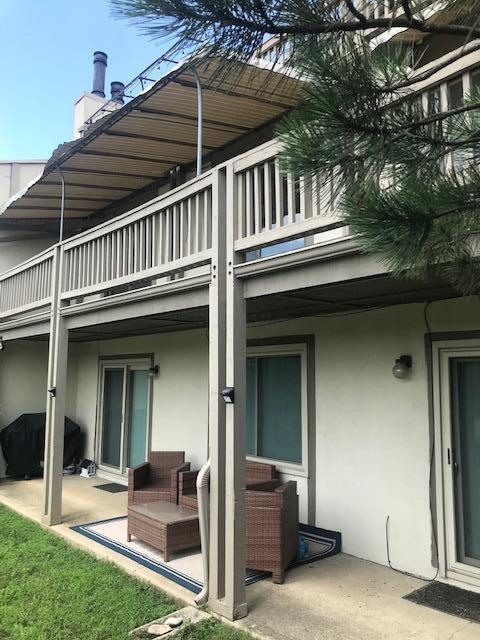 1395 Lake Shore Dr Unit 122, Columbus, OH 43204 - back of house with a balcony, stucco siding, and a patio area