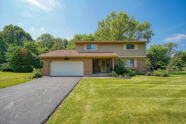 8899 Chevington Ct, Pickerington, OH 43147 - traditional home with brick siding, driveway, an attached garage, and a front yard