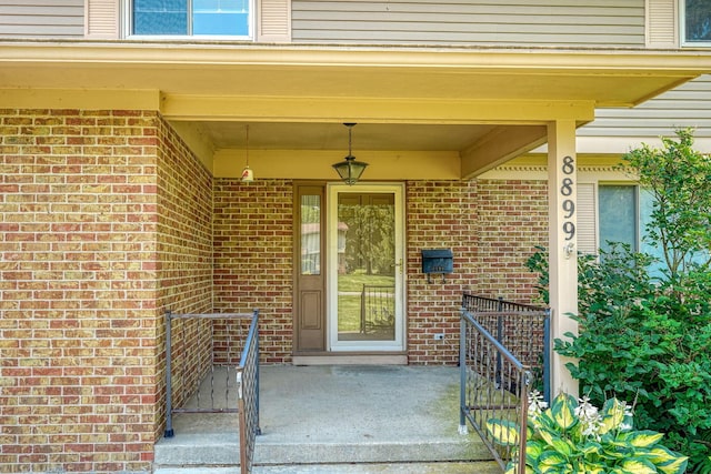 8899 Chevington Ct, Pickerington, OH 43147 - doorway to property with brick siding