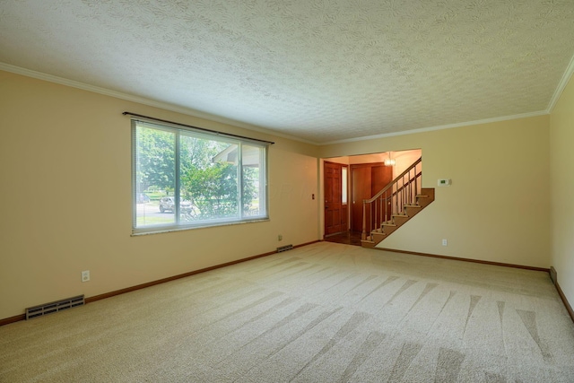 8899 Chevington Ct, Pickerington, OH 43147 - unfurnished room with carpet floors, stairway, a textured ceiling, and ornamental molding