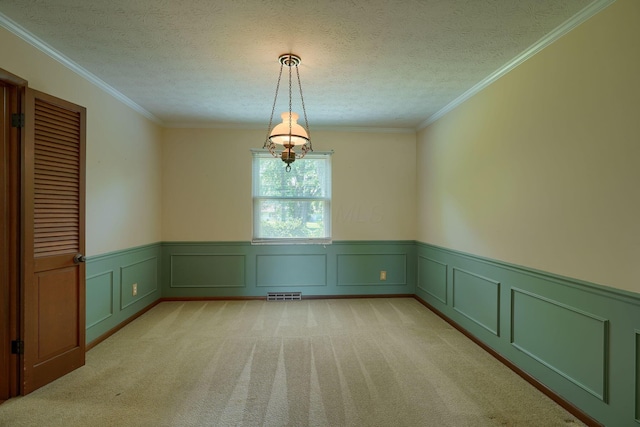 8899 Chevington Ct, Pickerington, OH 43147 - unfurnished dining area with light carpet, a wainscoted wall, ornamental molding, and a decorative wall