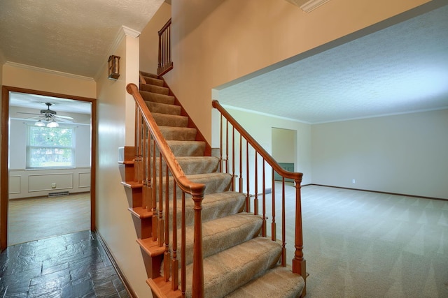 8899 Chevington Ct, Pickerington, OH 43147 - stairs with ornamental molding, a textured ceiling, stone tile floors, and a ceiling fan
