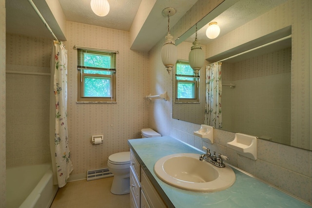 8899 Chevington Ct, Pickerington, OH 43147 - bathroom featuring vanity, wallpapered walls, baseboard heating, and shower / bath combination with curtain